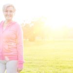 A woman enjoying gentle outdoor movement at sunrise, representing simple non-exercise movement for wellbeing
